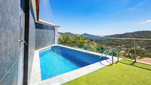 A swimming pool with a view of the landscape.
