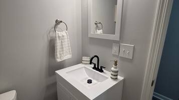 Hair dryer, towels, soap, toilet paper