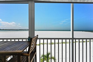 Outdoor dining - Ocean Vibes 2 BR, beachfront condo, endless shore/ocean views, steps to the sand (Fort Myers Beach)