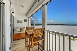 Outdoor dining - Ocean Vibes 2 BR, beachfront condo, endless shore/ocean views, steps to the sand (Fort Myers Beach)