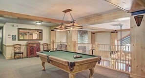 A pool table in a room with wooden beams, a mirror, and a staircase. - New Listing! Stylish new design, ski in/out. Watch World Cup, view golf course! (Frisco)