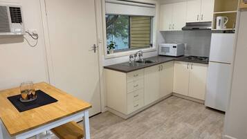 Fridge, microwave, toaster, cookware/dishes/utensils
