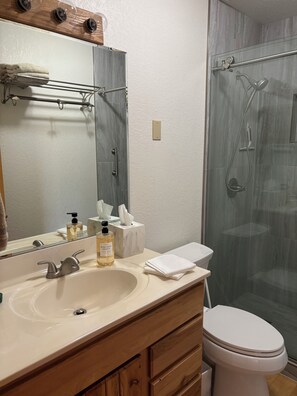 Shower, towels, soap, toilet paper