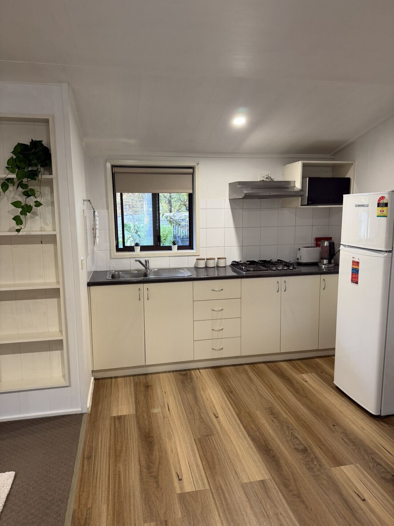 Microwave, toaster, cookware/dishes/utensils, dining tables