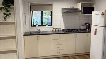 Microwave, toaster, cookware/dishes/utensils, dining tables