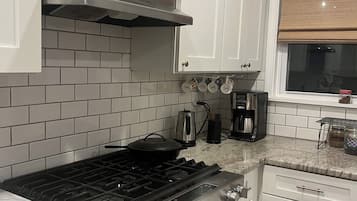 Fridge, stovetop, dishwasher, coffee/tea maker