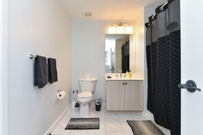 Shower, hair dryer, towels, soap - Luxe 1BR Retreat Minutes to NYC With High-End Finishes (Jersey City)