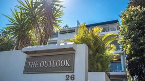 A sign with 'THE OUTLOOK' and the number '26' indicating a hotel or property. - "The Outlook" Views, Pool & Walk to Main Beach (Noosa Region)