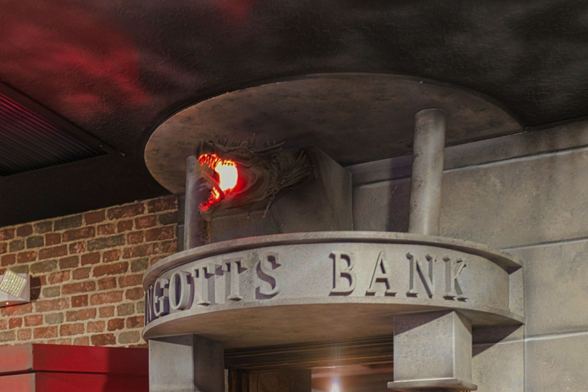 A bank's exterior with a sign that reads 'INGOT'S BANK' and a visible fire escape.