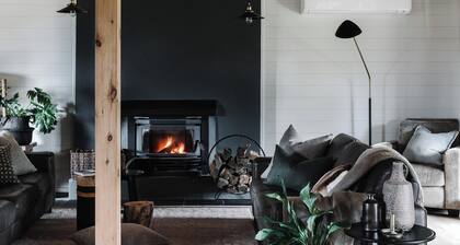 Stylish Gippsland country home with stunning views. Wood fires. Pet Friendly.