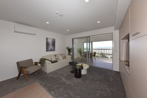 Beachfront Stay with Balcony & Ocean Views