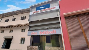 A building with a sign for 'Via Shera Residency' and another sign in a different language. - Via Shera Residency (Mumbai)