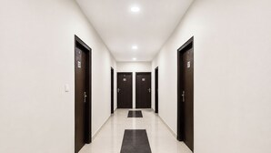 A corridor with doors labeled 501 and 502, leading to rooms. - Via Cosy Stay (New Delhi)