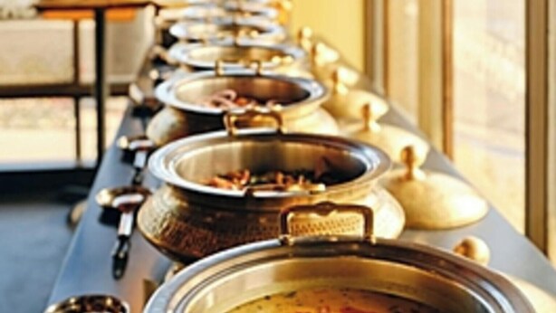 A buffet line with multiple food containers. - Via Ak Residency (New Delhi)
