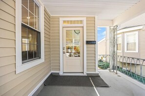 A house with a front door, a window, a mailbox, and a small porch area. - Modern 6BR | Sleeps 14 | 1.5 Blks to Beach (Ventnor City)