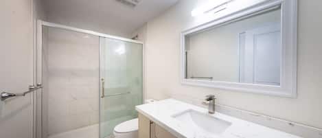 Shower, hair dryer, towels, soap