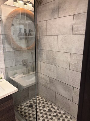 Shower, hair dryer, towels, soap