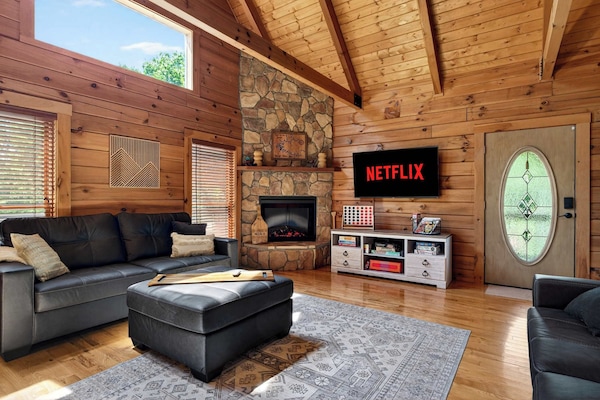 Living Room: Gather around the fireplace after a day on Rough River Lake — this is where the group stories get told.
