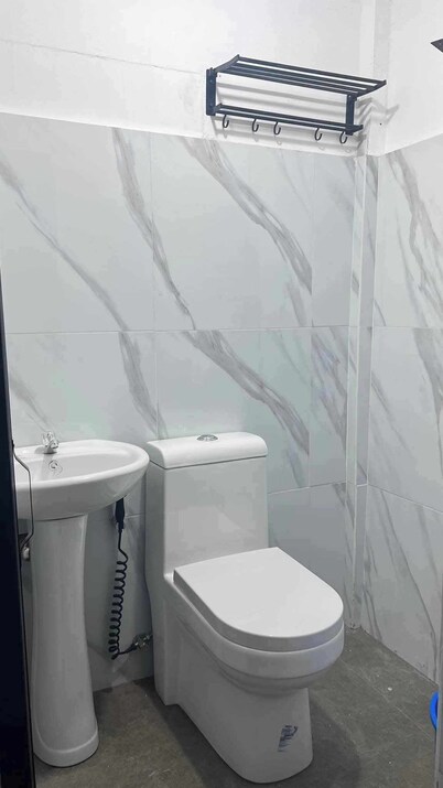 Cozy 1-bedroom hotel suite in fabulous General Luna with AC