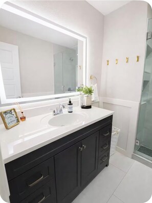 Shower, hair dryer, towels, soap