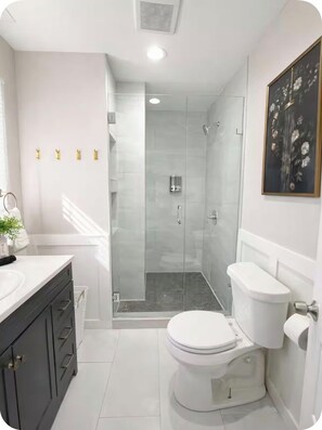 Shower, hair dryer, towels, soap