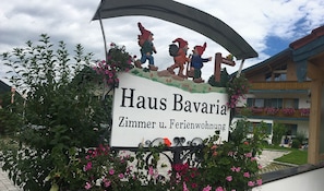 A sign for Haus Bavaria, indicating it is a hotel with a garden area. - Apartment type A 11, shower and WC, balcony, kitchenette, TV, WLAN (Ruhpolding)