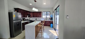 Private kitchen - Just 5-minutes away to the beach. Spacious 5-bedroom house at Costa Azul,Metalio (Metalio)