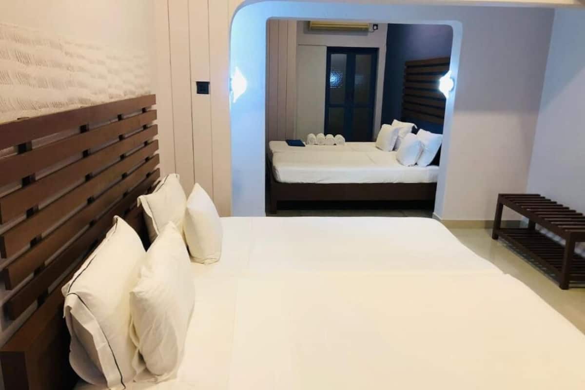Deluxe Quadruple Room, Patio, Courtyard View | Desk, laptop workspace, free WiFi