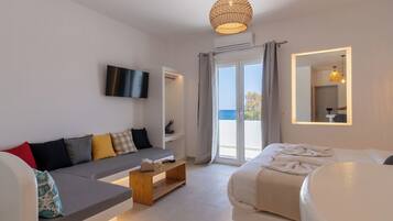 Appartamento Executive, vista spiaggia | Biancheria da letto di alta qualità, postazione laptop