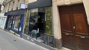 A multi-story building with a storefront labeled 'CRD SHOP' and a visible address number '25'. - Bohemian & Historic Paris Panthéon - Mosquée (Paris)