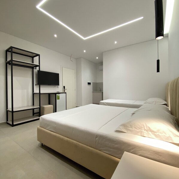 Family Triple Room, Garden View | Premium bedding, memory-foam beds, laptop workspace, blackout curtains