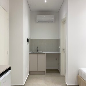 Family Triple Room, Garden View | Private kitchen | Electric kettle, paper towels