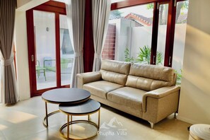 Habitación triple familiar, 3 habitaciones | Zona de estar