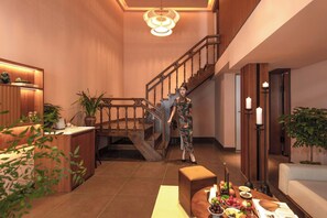 Suite superior, vista al patio | Sala de estar