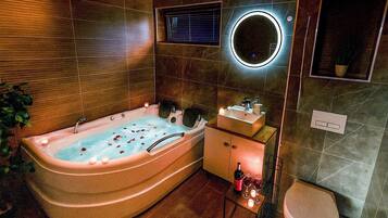 Bathtub, hair dryer, towels, soap