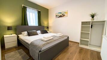 Deluxe Apartment, Garden View | Desk, laptop workspace, free WiFi