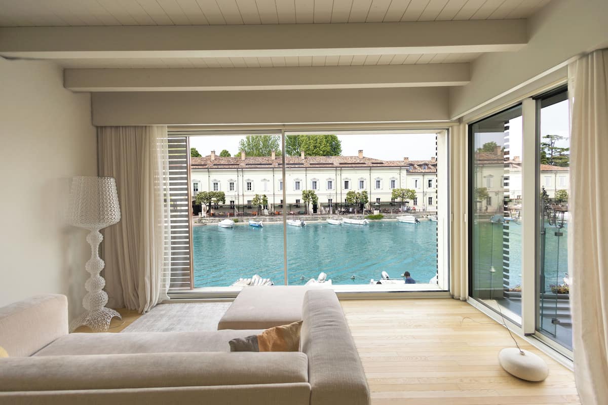 A balcony with a view of a marina and buildings.