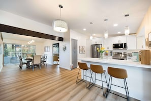 This bright, open space flows seamlessly—from the kitchen island to the dining area, it’s perfect for group gatherings. - Bellevue Family-Friendly 4BR Home, Near Issaquah (Bellevue)