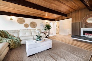 Wooden ceiling beams and warm decor make this space feel like a mountain retreat. - Bellevue Family-Friendly 4BR Home, Near Issaquah (Bellevue)