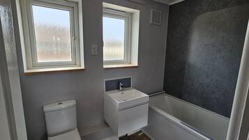 Combined shower/bathtub, deep-soaking bathtub