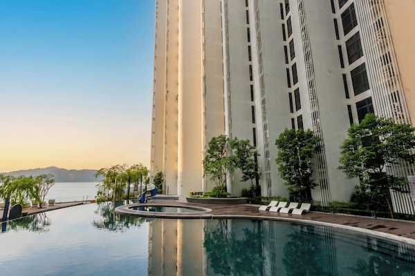 Outdoor pool, open 7:00 AM to 10:00 PM, sun loungers