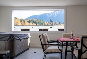Dining - Spacious Revelstoke rental near ski hill and downtown, with private hot tub, full kitchen, and comfortable living areas for up to 5 guests. (Revelstoke)