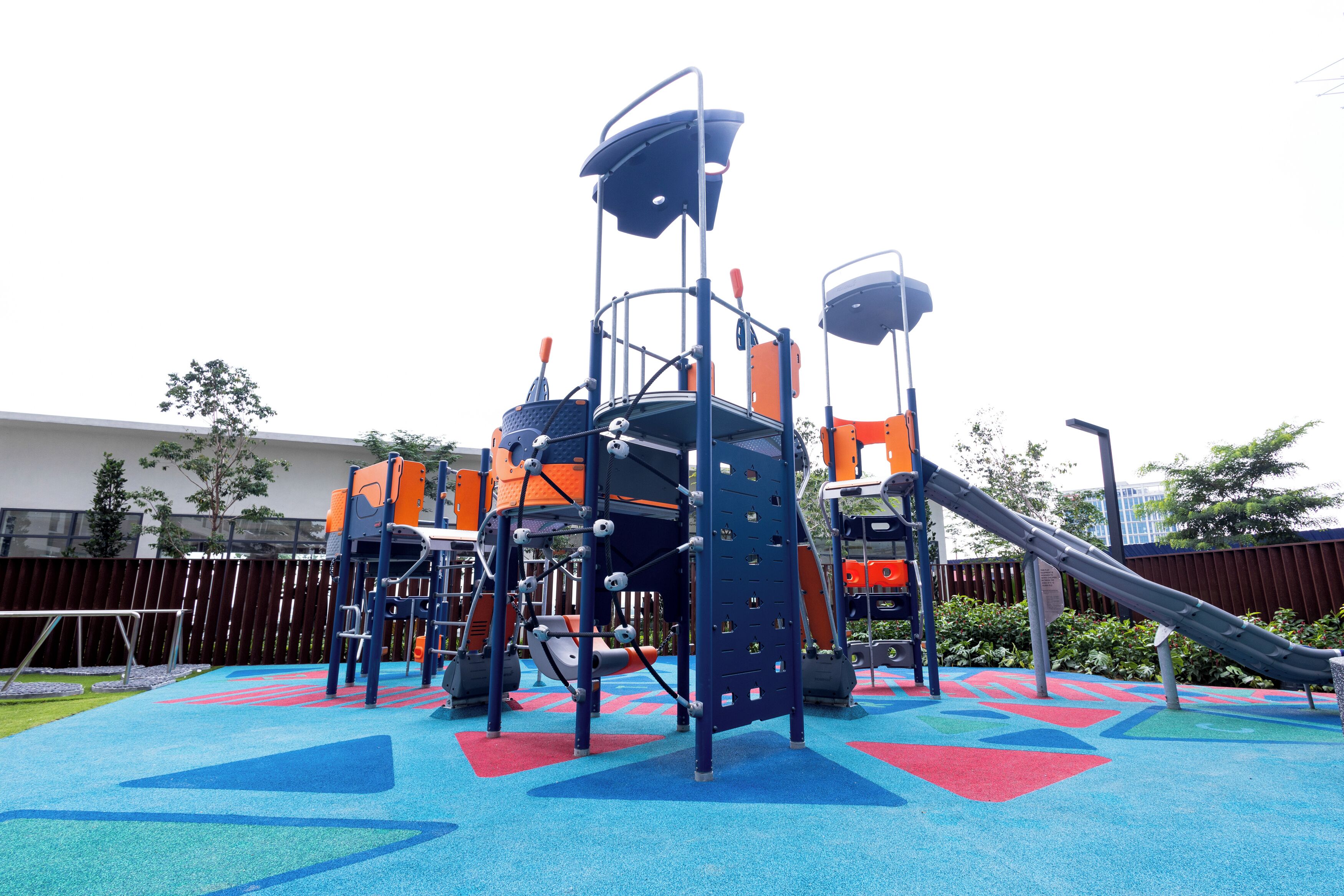 A playground with climbing structures and slides.