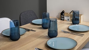 A dining table with blue plates, clear glassware, and cutlery. - City Vibes - 2-BR Apt. with Backyard in kolonaki (Athens)