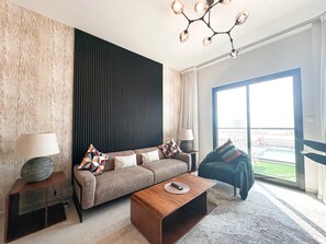 Standard Apartment, Balcony | Living area | 42-inch Smart TV with satellite channels, Netflix, streaming services - Stunning 1BR Luxury Apt with Pool View (Dubai)