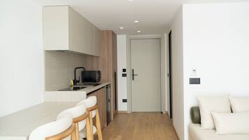 Deluxe Duplex, 1 Bedroom, Balcony | Living area | 40-cm Smart TV with satellite channels