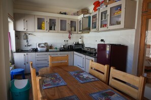 Deluxe Room, Balcony | Shared kitchen facilities