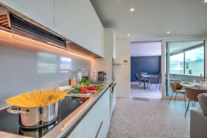 Family Apartment, Multiple Bedrooms (Urban Maggiolina Sunset - Locarno) | Private kitchen | Fridge, oven, stovetop, dishwasher - Urban Maggiolina Sunset - Locarno (Locarno)