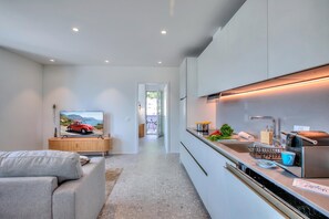 Family Apartment, Multiple Bedrooms (Urban Maggiolina Sunset - Locarno) | Private kitchen | Fridge, oven, stovetop, dishwasher - Urban Maggiolina Sunset - Locarno (Locarno)