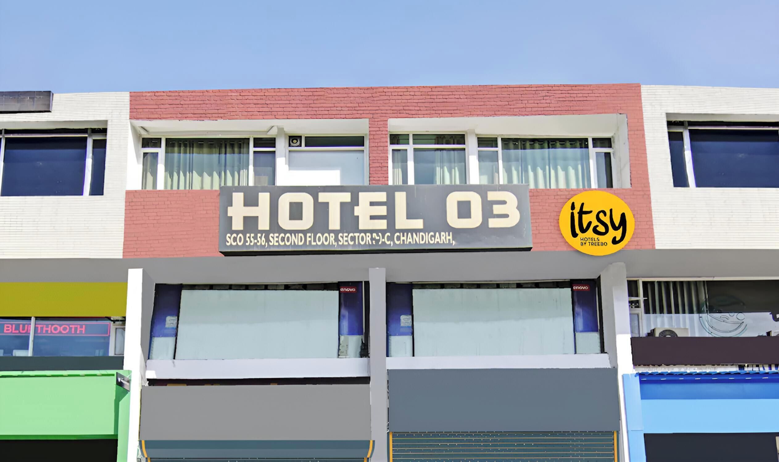 A hotel sign with 'HOTEL 03' and 'itsy hotels by treedo' branding.
